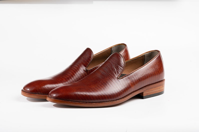 Here are some SEO-friendly keywords for the One Piece Wholecut Loafer Slip-On Lizard Embossed Leather Shoes: - One Piece Wholecut Loafers - Lizard Embossed Leather Loafers - Slip-On Wholecut Loafers for Men - Lizard Patterned Leather Loafers - Men’s Wholecut Slip-On Shoes - One Piece Leather Loafers - Lizard Embossed Slip-On Shoes - Stylish Wholecut Loafers for Men - Embossed Leather Wholecut Loafers - Men’s Lizard Embossed Loafers