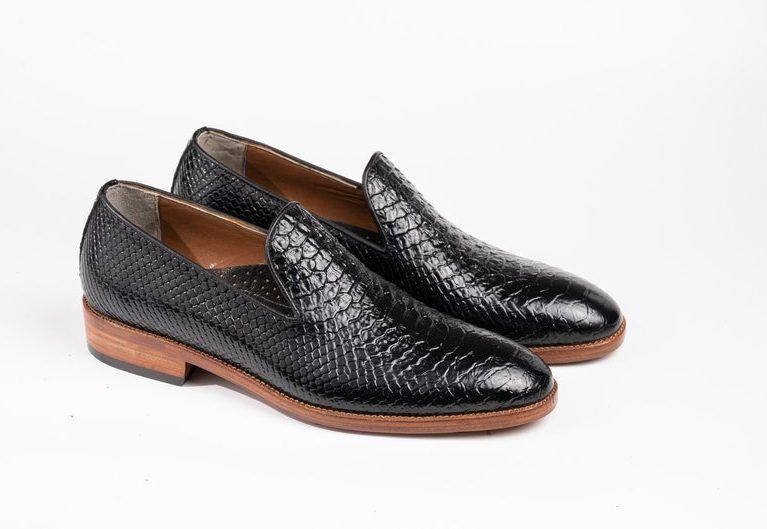 "Black Exotic Loafers: Handcrafted from premium leather. Wholecut Loafers: Custom-made with exotic fish leather. Formal Shoes: Featuring a vegetable-tanned sole and cushioned footbed. Luxury Footwear: Bespoke design for a personalized fit. Breathable Lining, Durable Construction: Stylish and functional."